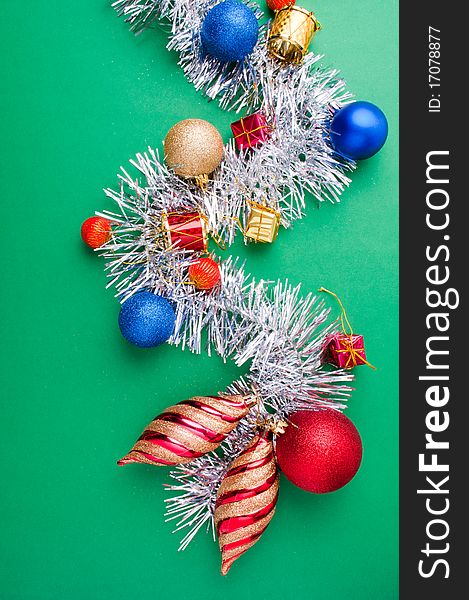 Christmas decoration objects on light green background. Christmas decoration objects on light green background