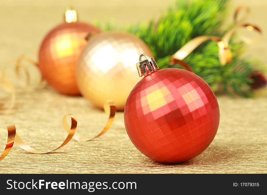 Color christmas balls on golden background