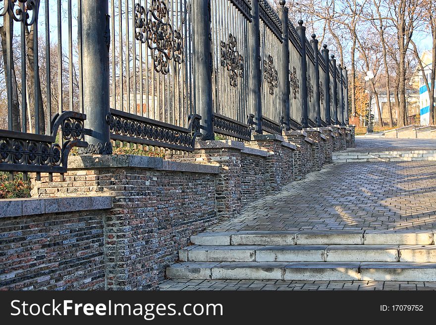 Forged metal fence in the city park