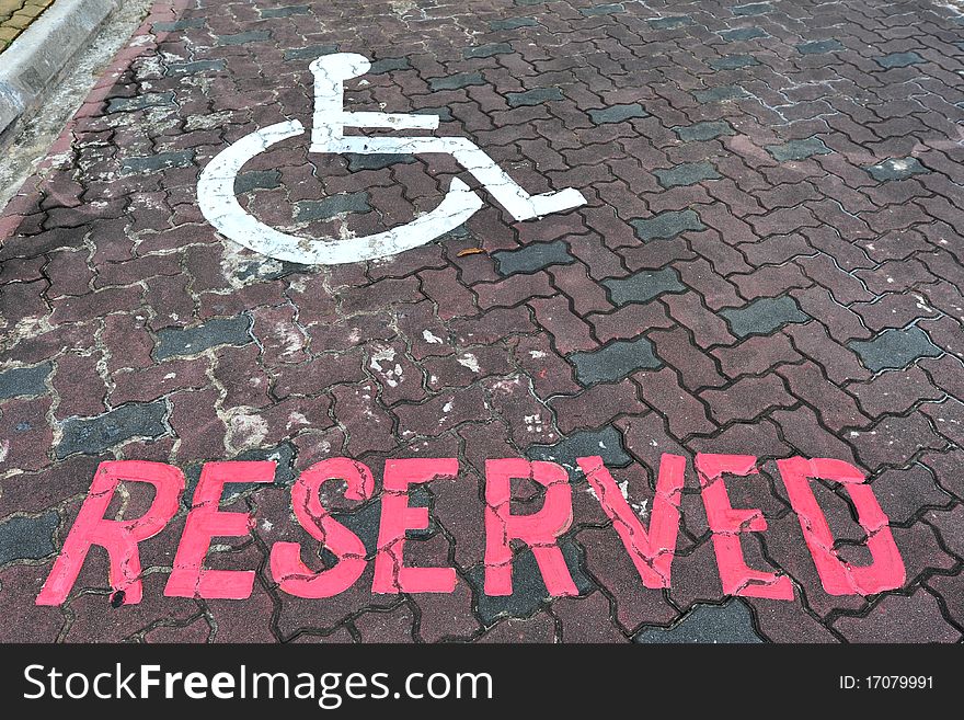 Reserved Car Parking Lot For The Handicap With Wheel Chair Sign. Reserved Car Parking Lot For The Handicap With Wheel Chair Sign