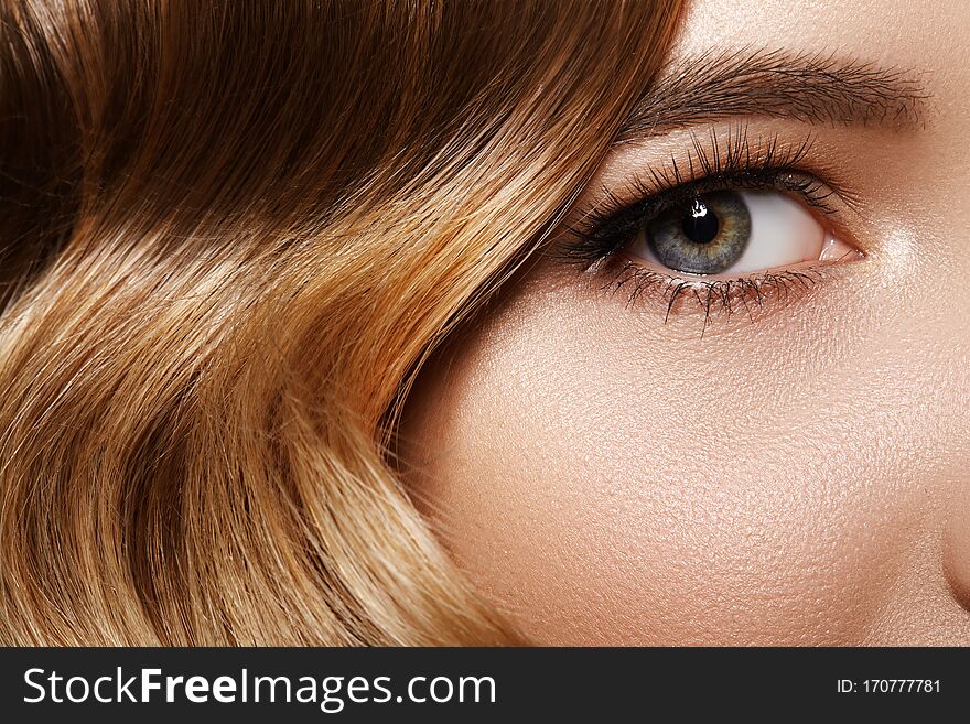 Beautiful Macro Of Female Eye With Classic Makeup. Good Vision. Perfect Curly Long Lashes, Wavy Shiny Hair. Retro Beauty