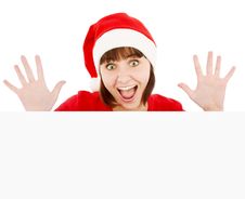 Surprised Santa Woman Peeking From Blank Billboard Royalty Free Stock Photography