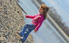 Little Girl Playing At The Beach In Winter Royalty Free Stock Images Little Girl Playing At The Beach In Winter Royalty Free Stock Images