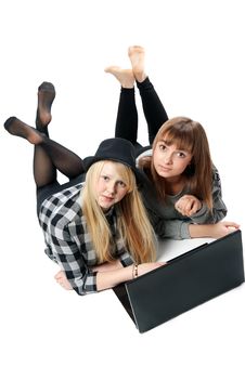 Two Girls Lies With Computer Royalty Free Stock Images Two Girls Lies With Computer Royalty Free Stock Images
