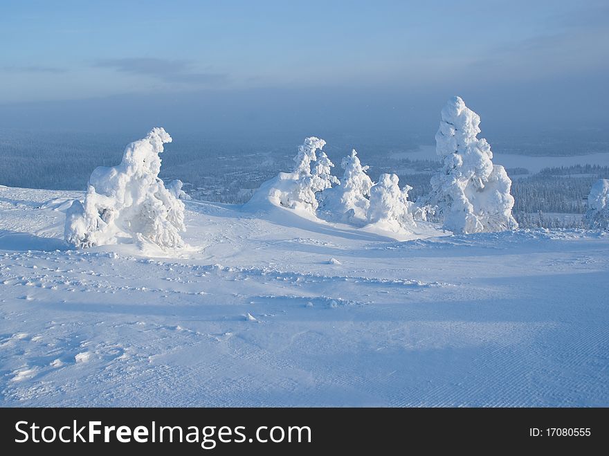 Cold northern winter in the mountains, a landscape with natural snow sculptures