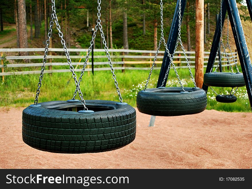 Close up of automobile tires swings