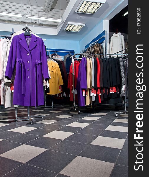Female cloth shop interior. Coats. Female cloth shop interior. Coats.