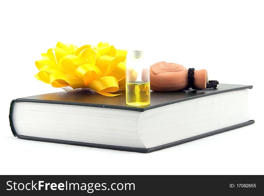 Book and old yellow perfum