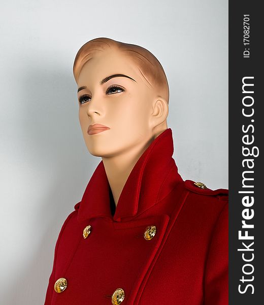 Red coat on mannequin in shop