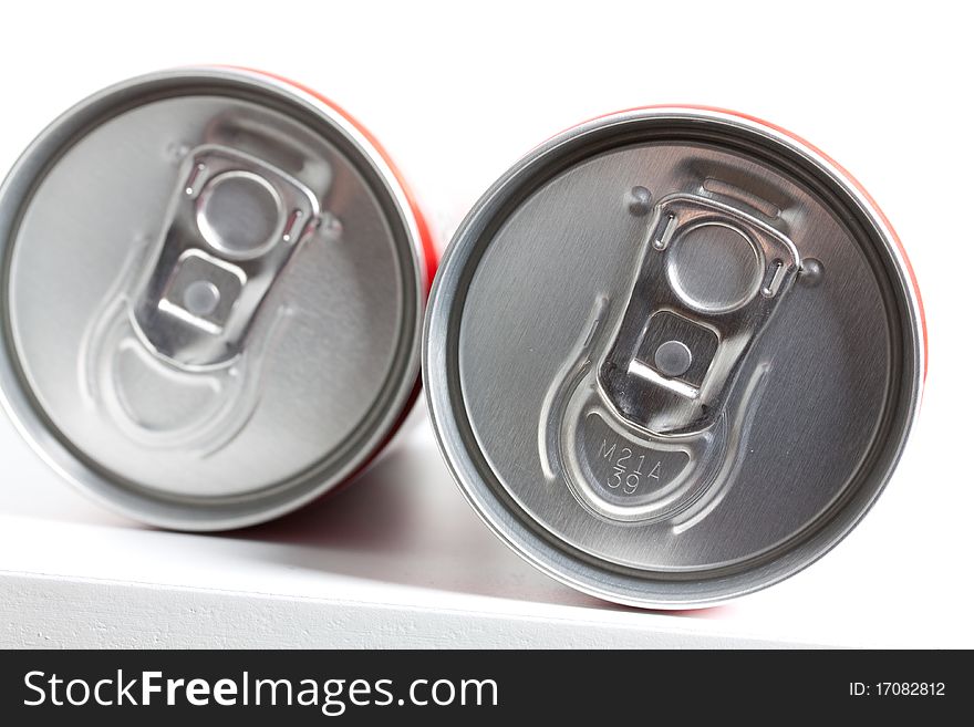 Two cans filled with soda