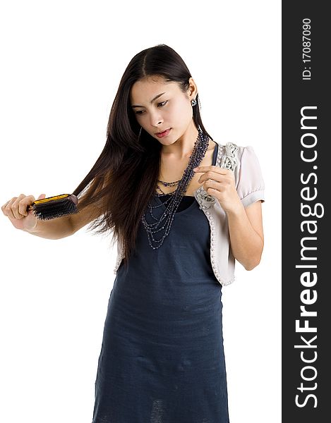 Pretty woman brushing her long hair, isolated on white background. Pretty woman brushing her long hair, isolated on white background