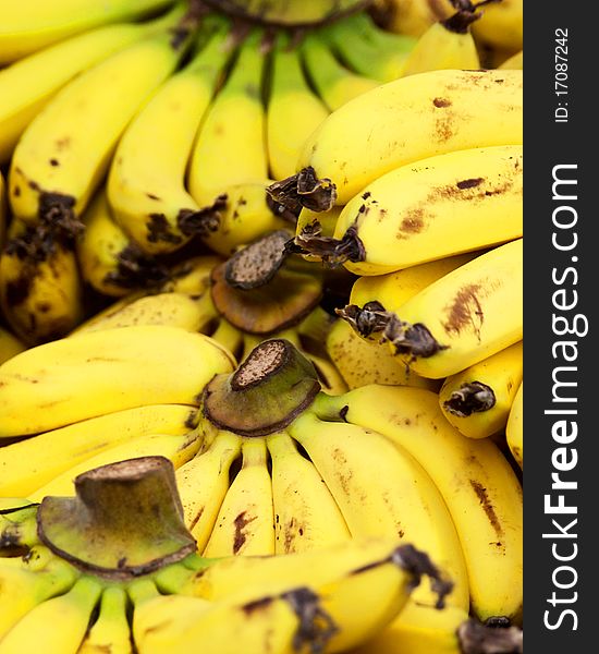 Sheaf of ripe and appetizing bananas close up