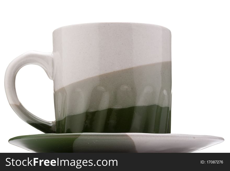 Ceramic mug and saucer with greyish green for hot drinks.