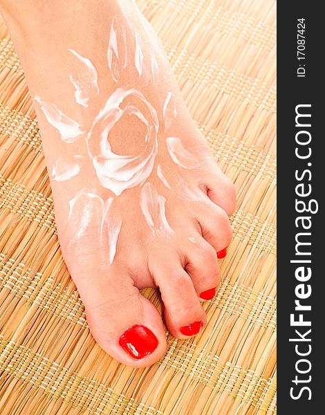 Beautiful woman's foot with the drawing of the sun. Beautiful woman's foot with the drawing of the sun