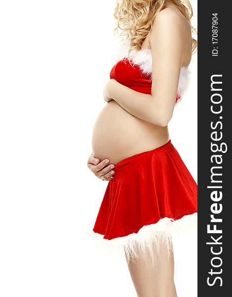The image of a beautiful pregnant woman in a Christmas Santa suit