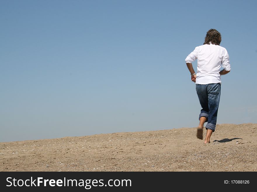 Excited successful business man jumping in the air. Excited successful business man jumping in the air