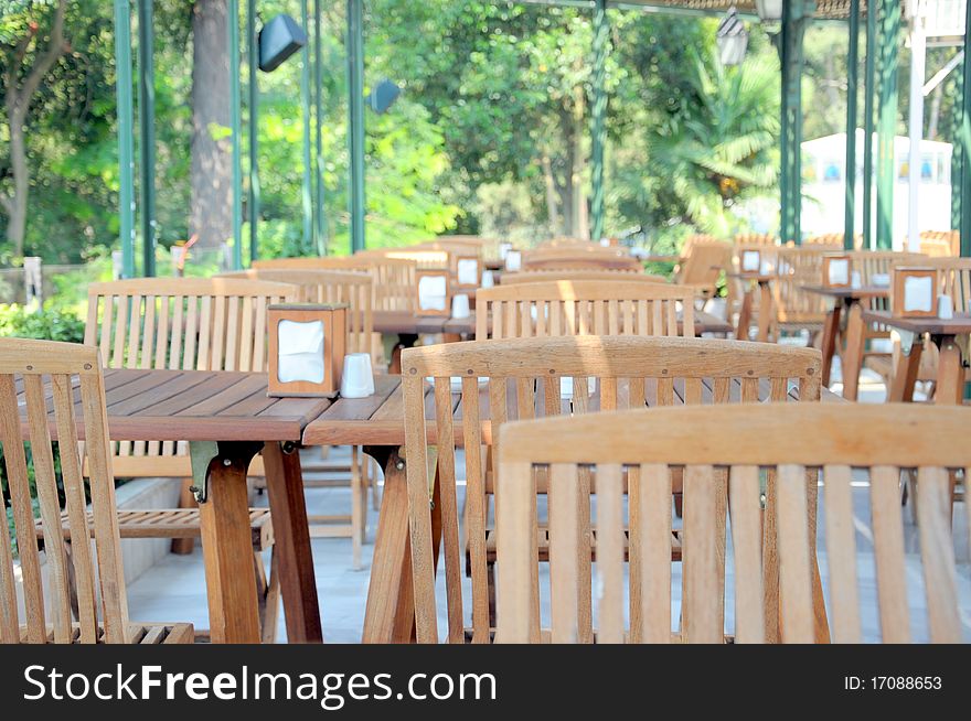 Wooden chairs and tables at a cafe