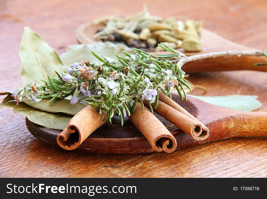 Macro view of the different spices on wooden background