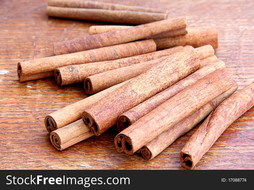 Macro view of Cinnamon on wooden background