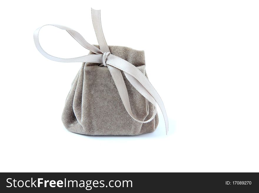 Small bag with ribbon isolated on white. Small bag with ribbon isolated on white.