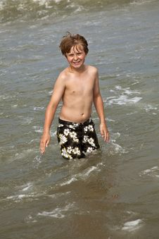 Cute Boy Enyoys The Water In The Ocean Stock Photography