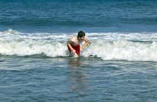 Young Boy Is Body Surfing In The Waves Royalty Free Stock Photos