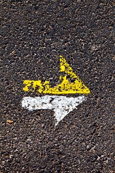 Arrow In Yellow And White On A Paveway Royalty Free Stock Photos Arrow In Yellow And White On A Paveway Royalty Free Stock Photos