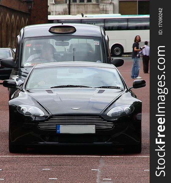 A sports car in the near of Buckingham Palace - very fast and much Power