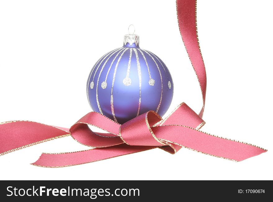 Blue and silver Christmas tree ball and gold edged red ribbon. Blue and silver Christmas tree ball and gold edged red ribbon