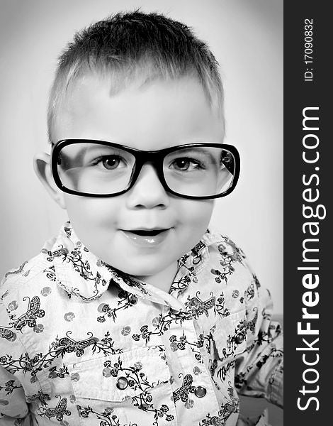 black - white picture of a boy with glasses