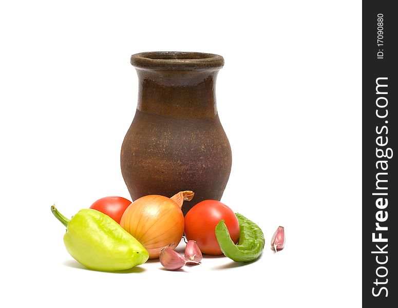 Still life with old clay jug on a white background. Still life with old clay jug on a white background.