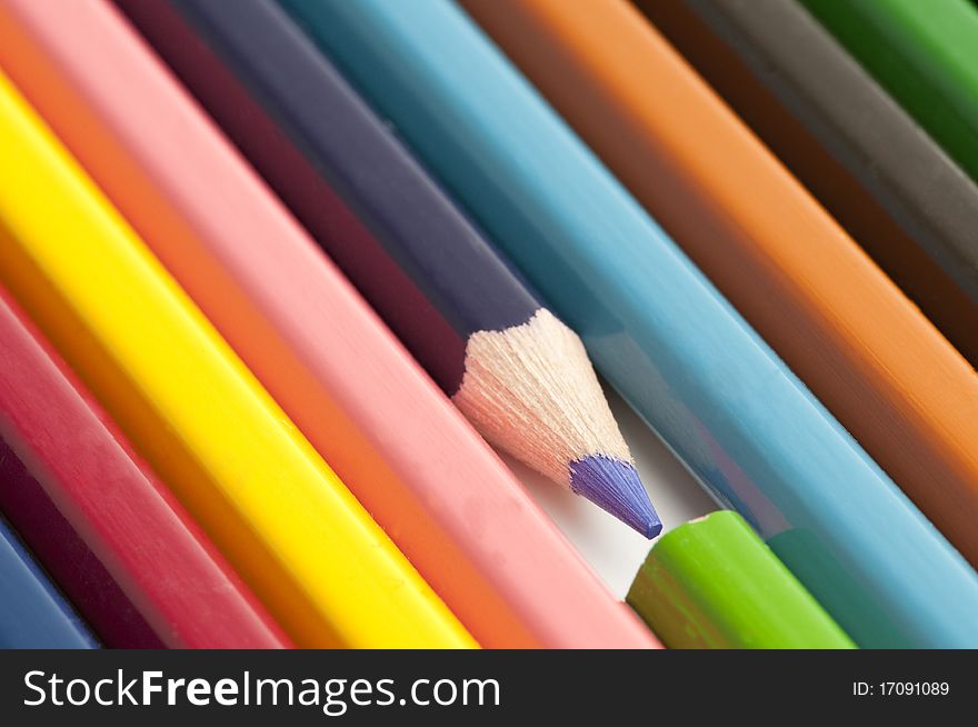 Colourful pensils on a table ready to be used.