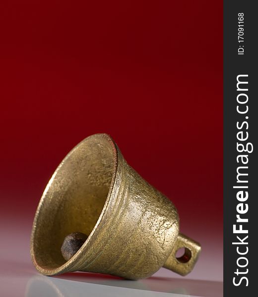 Bell against red background,for ringing,christmas or alert themes. Bell against red background,for ringing,christmas or alert themes