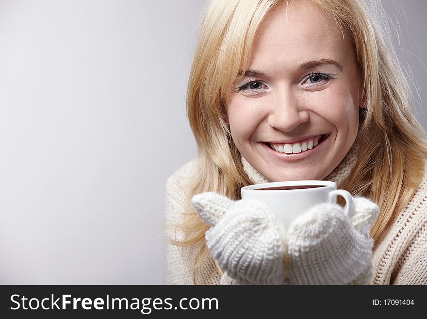 Attractive girl with a cup on a white background. Attractive girl with a cup on a white background