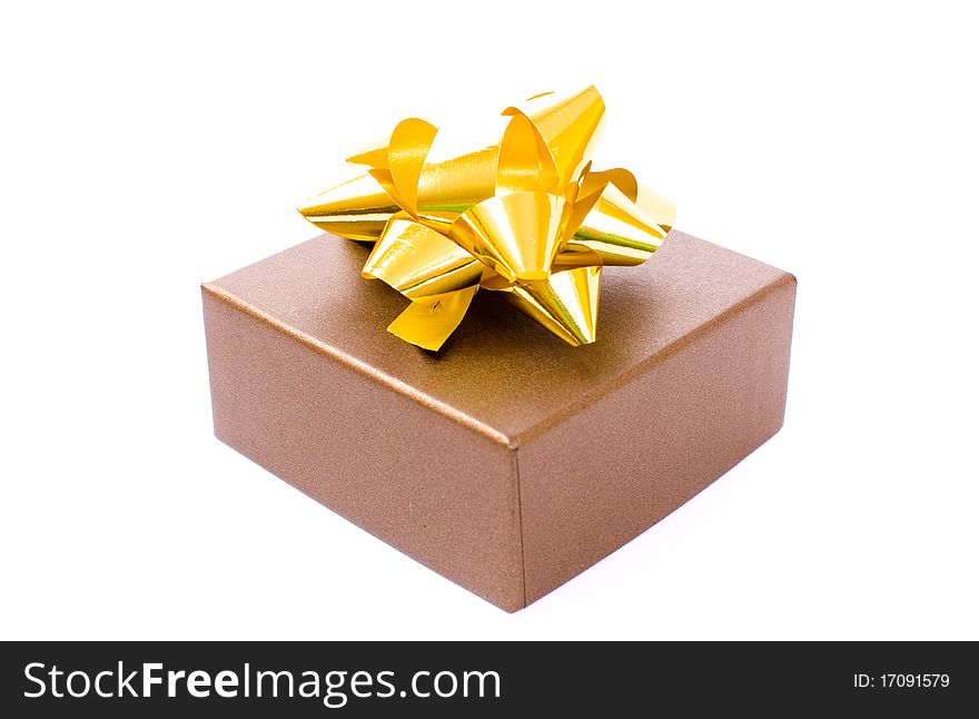 Christmas gift-box on white background, with golden ribbon