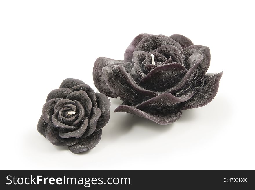 Black Candles in the shape of a flower on a white background. Black Candles in the shape of a flower on a white background