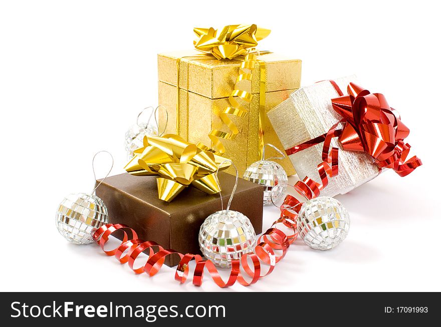 Christmas gifts - three colorful gift-boxes with ribbons and decorations