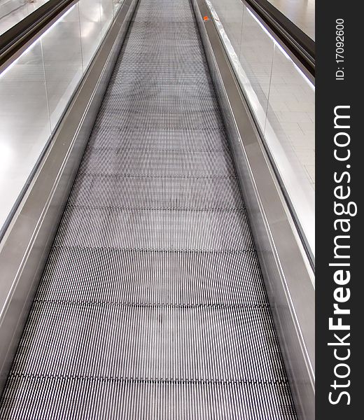 Moving walkway in the arrival hall of the modern airport