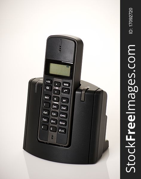 A vertical image of a modern digital phone isolated on a plain background