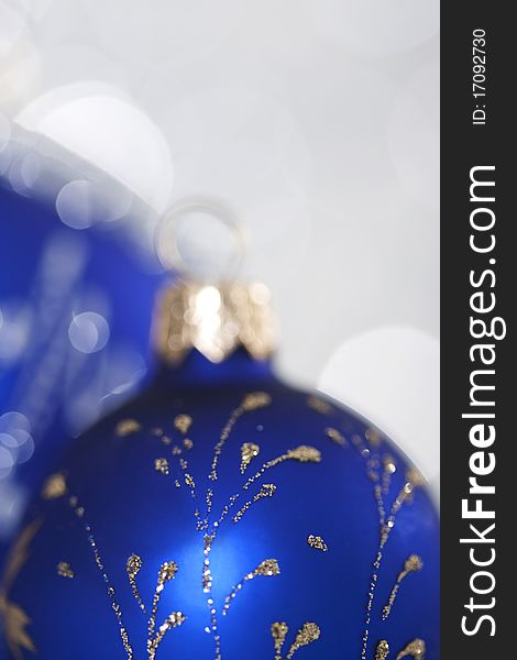 Blue christmas ball on abstract light background. Blue christmas ball on abstract light background.