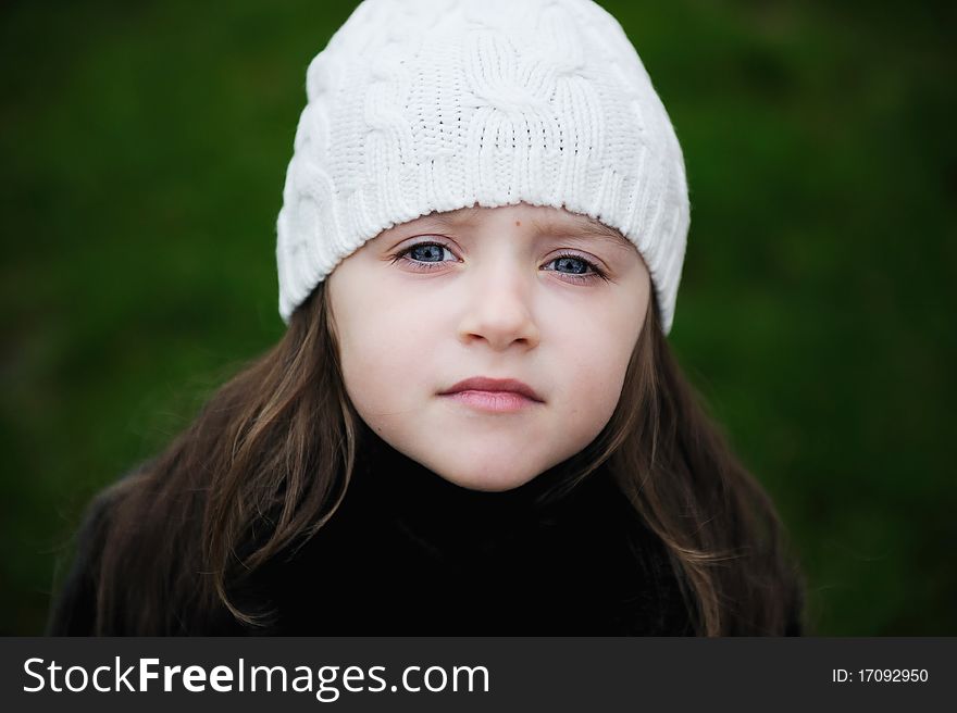 Beauty Small Girl With Blue Eyes In White Hat