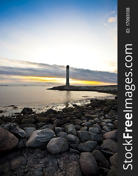Old Lighthouse at dawn on swedeish coast