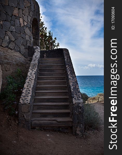 Small staircase leading to an old building at the beach