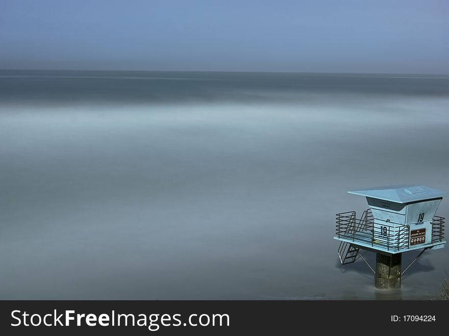 In the middle of the night, a single life guard tower watches over the rising sea created by a nearby tsunami. In the middle of the night, a single life guard tower watches over the rising sea created by a nearby tsunami.