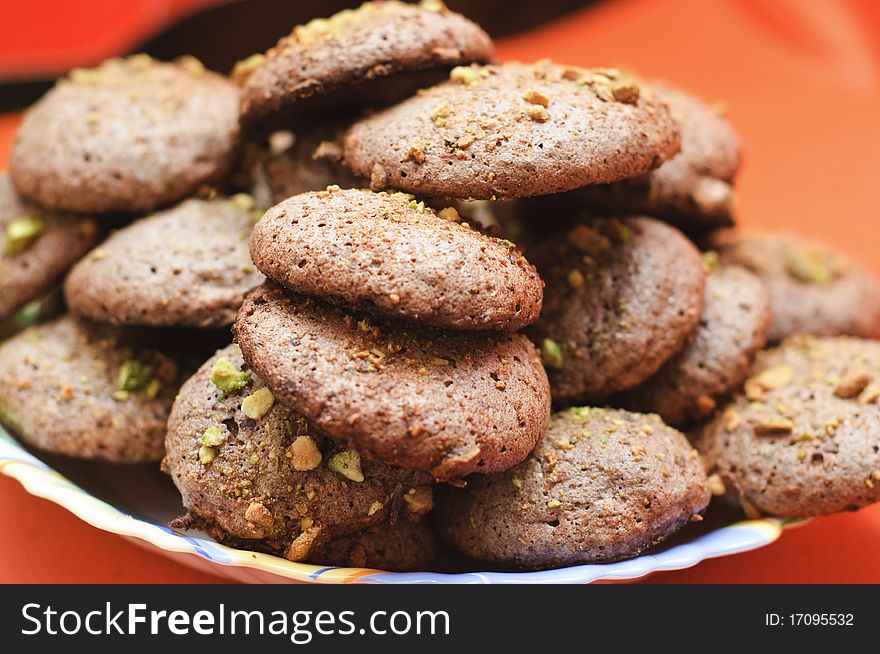 Almond and chocolate cookies sprinkled with pistachio