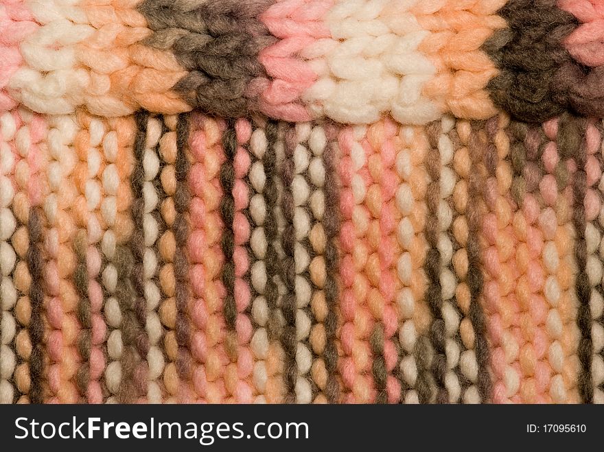 Knitted stripped brown, pink, white background. Knitted stripped brown, pink, white background