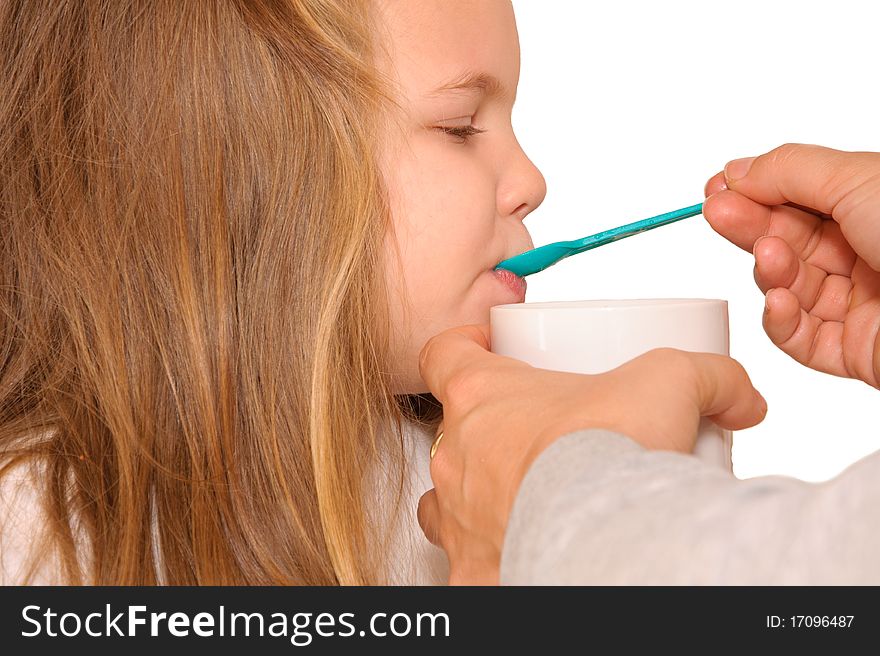 Little girl with spoon in her mouth. Little girl with spoon in her mouth