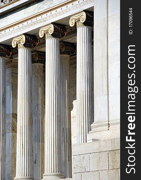 Detail of The National Academy Building in Athens showing colossal columns of the building. The building, which was built from 1859-1885, is located on the south of The University of Athens' main building (Panepistimio street). Detail of The National Academy Building in Athens showing colossal columns of the building. The building, which was built from 1859-1885, is located on the south of The University of Athens' main building (Panepistimio street).