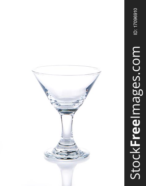 EmptyShiny Martini cocktail glass isolated on a white background. EmptyShiny Martini cocktail glass isolated on a white background