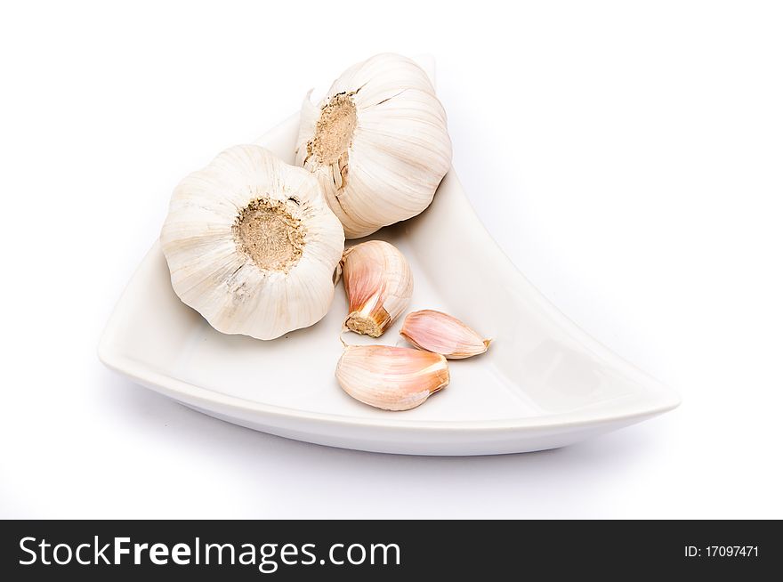 Garlic on a white plate